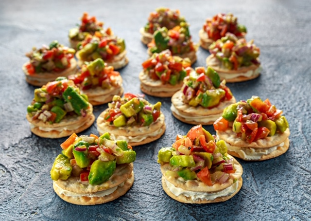 Salsa canapé cracker appetizers with soft cheese